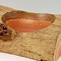 This bowl is red Eucalyptus with some neat curl. It's about 12" x 7" or so. The contrast between the smooth bowl and the rough-sawn ends and natural log surfaces creates a 'must feel' tactile experience.